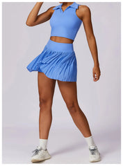 Conjunto Fitness com Cropped Gola Polo e Saia Shorts Plissada