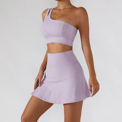 Conjunto Fitness Feminino com Top Ombro Só e Saia com Shorts