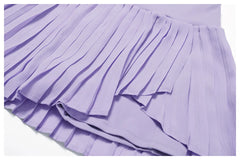 Conjunto Fitness com Cropped Gola Polo e Saia Shorts Plissada