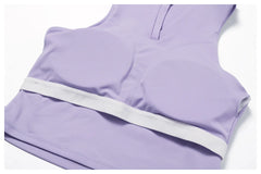 Conjunto Fitness com Cropped Gola Polo e Saia Shorts Plissada
